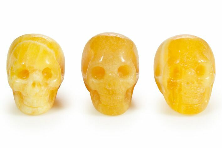 1.5" Polished Orange Calcite Skulls - Photo 1